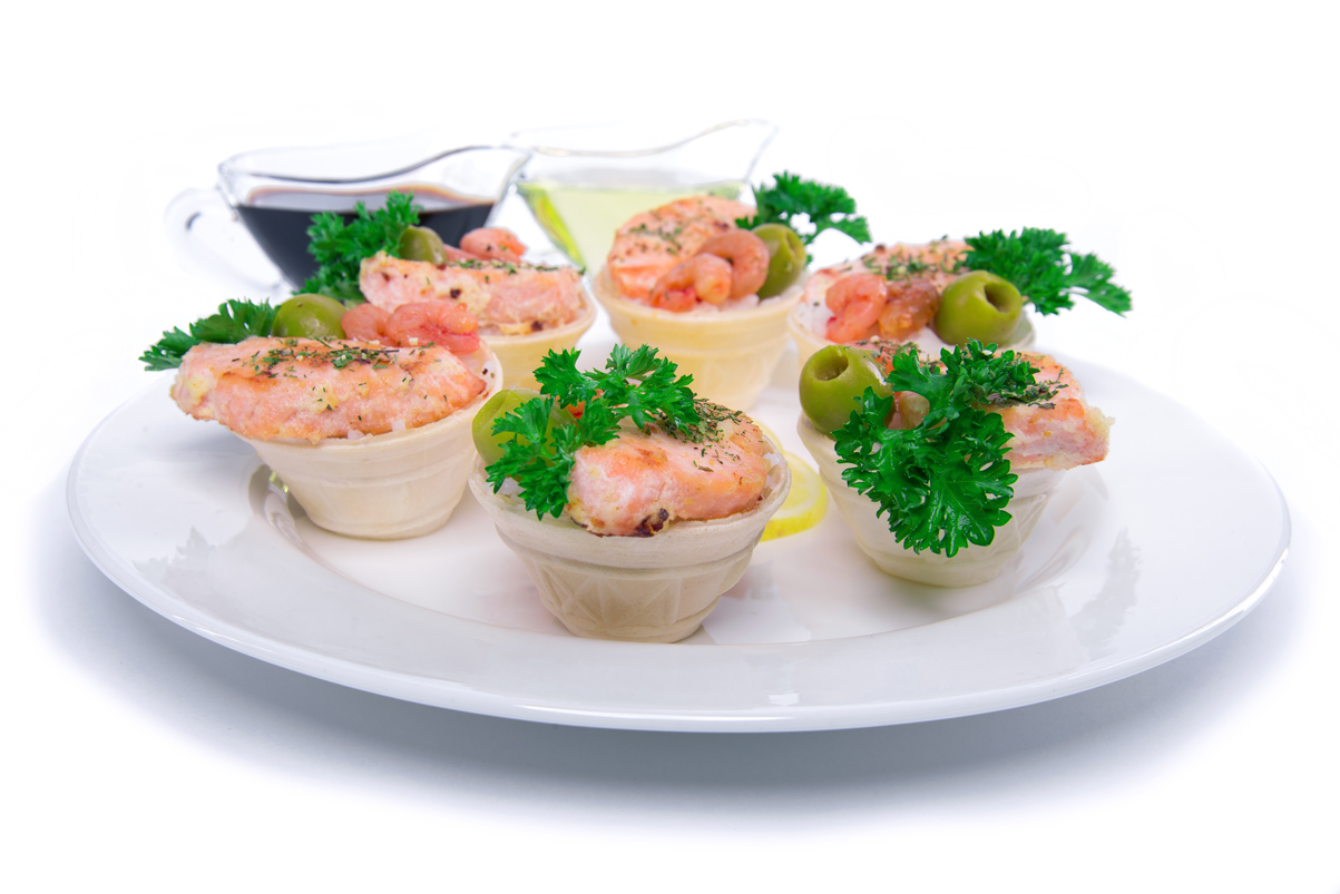 Tartlets with salmon on white background